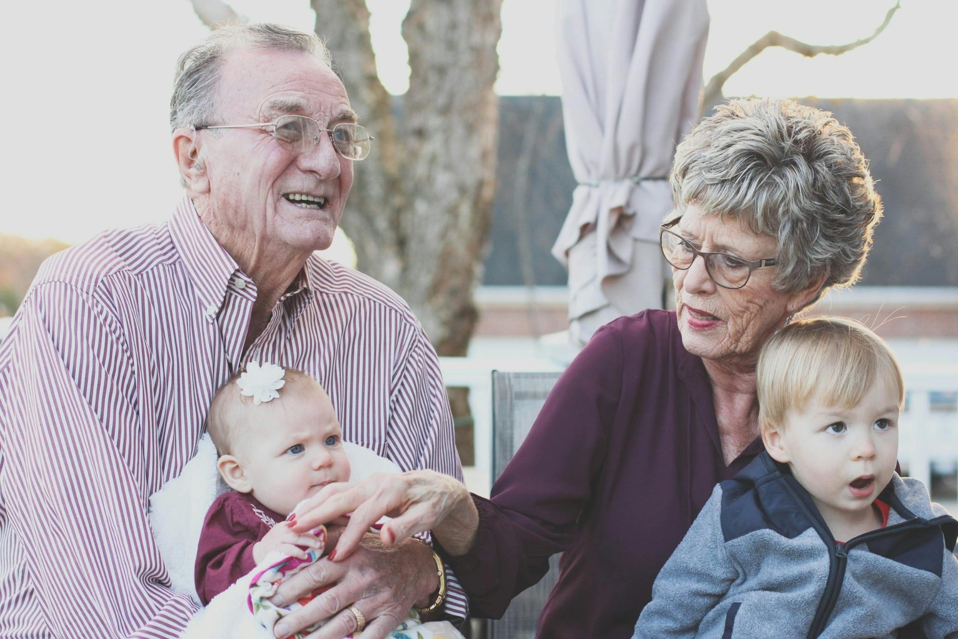 Grandparents holding grandchildren